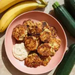 Deliciously golden Banana Zucchini Fritters served on a plate