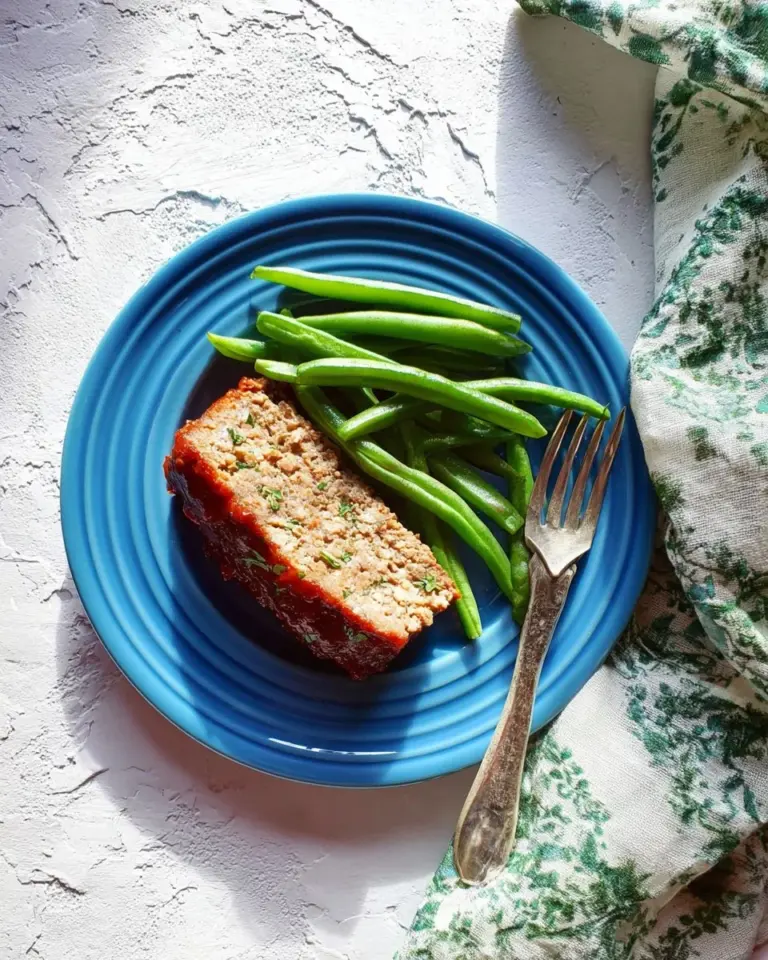 Delicious Turkey Cauliflower Meatloaf with vegetables and herbs fresh out of the oven