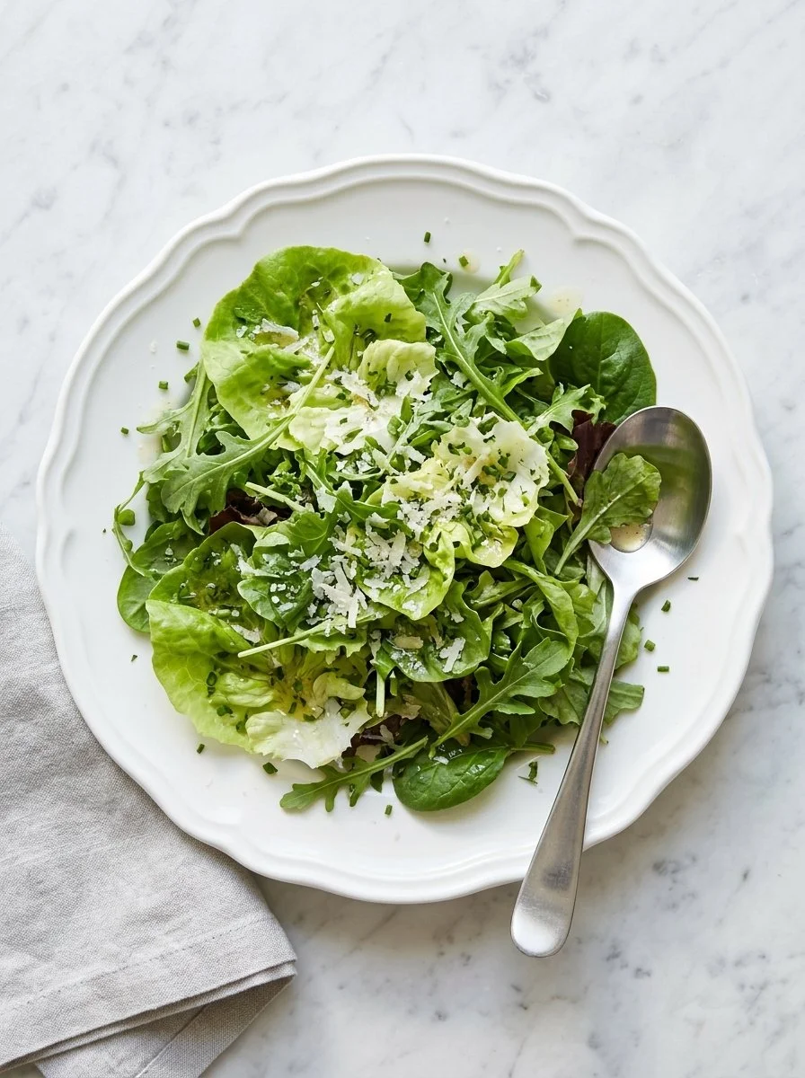 Mixed green salad drizzled with red wine vinaigrette dressing.